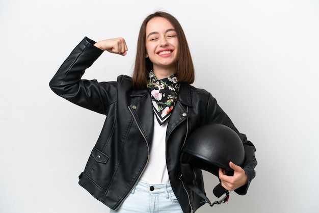 Giovane donna ucraina con un casco da motociclista isolato su sfondo bianco che fa un gesto forte