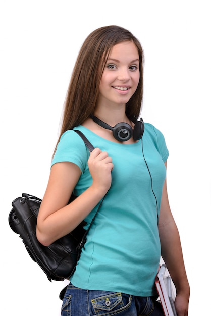 Giovane studente sorridente felice con la sua borsa di scuola.