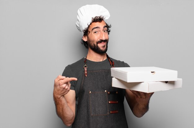 Giovane uomo barbuto. concetto di pizzaiolo