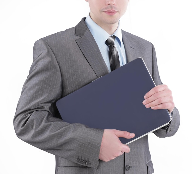 Giovane uomo d'affari con un laptopisolated su bianco