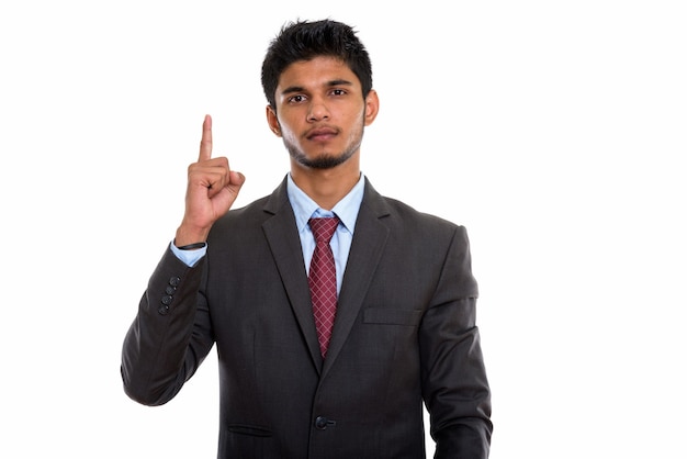giovane uomo d'affari indiano bello che indica il dito verso l'alto