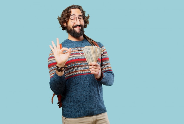 Giovane uomo hippie con banconote