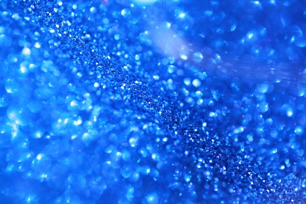 glitter blu con sfondo bokeh. Texture lucida con riflessi.