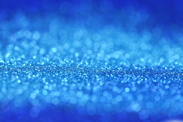 glitter sfondo blu con luce blu brillante bokeh.