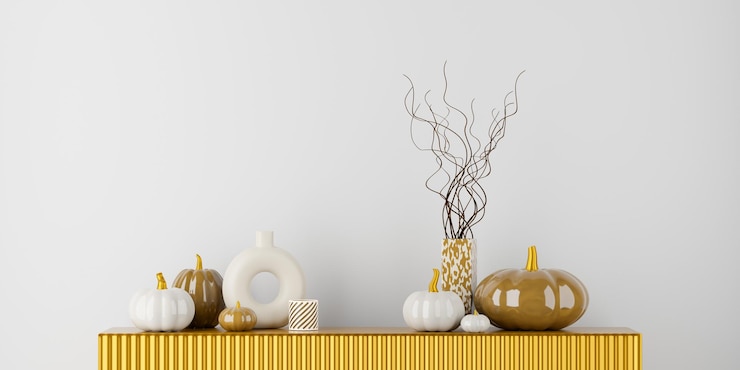 Photo glossy decorative pumpkins with vases on golden shelf autumn and halloween interior 3d rendering