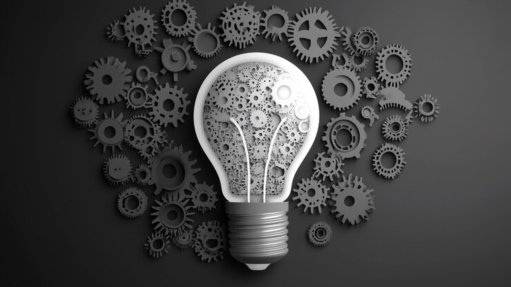 glowing light bulb and gear mechanism on dark background