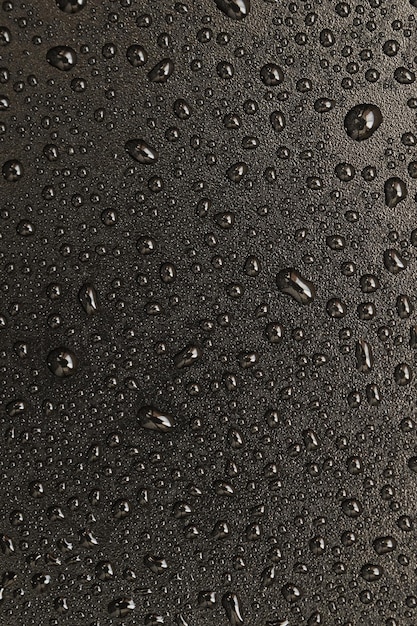 Gocce d'acqua su sfondo nero. Gocce di texture foto macro.