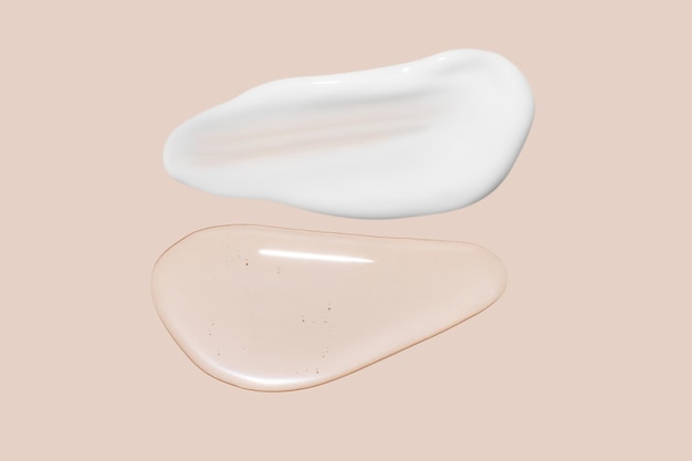 Gocce di gel trasparente e un tocco di crema cosmetica bianca Su fondo beige