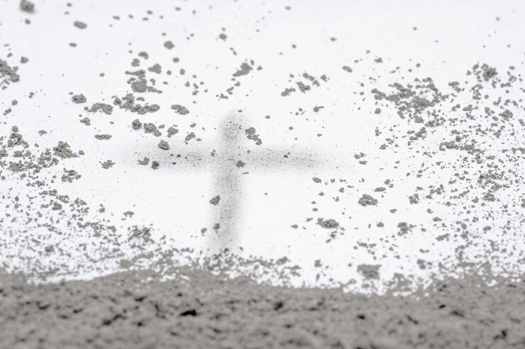 Golgotha hill with cross of Jesus Christ drawing made in ash sand or dust as christian crucifixion calvary of God on Good Friday before Easter or Ash Wedneday concept GLOBAL FORGIVENESS DAY