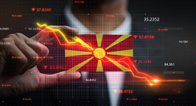 Grafico che cade davanti alla bandiera della Repubblica di Macedonia. Concetto di crisi