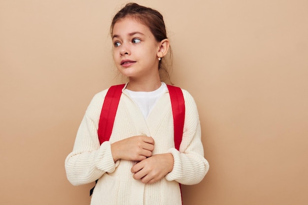 Graziosa ragazza studentessa zaino scuola infanzia inalterata