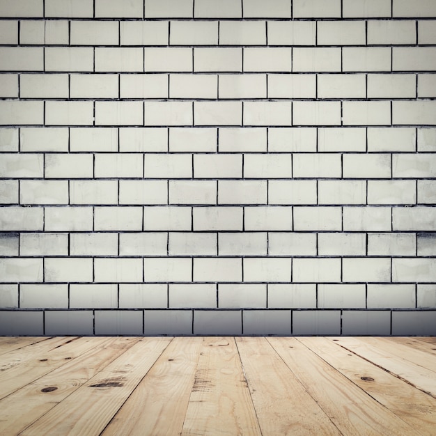 Grunge sfondo bianco muro di mattoni e pavimento in legno prospettiva camera interna.