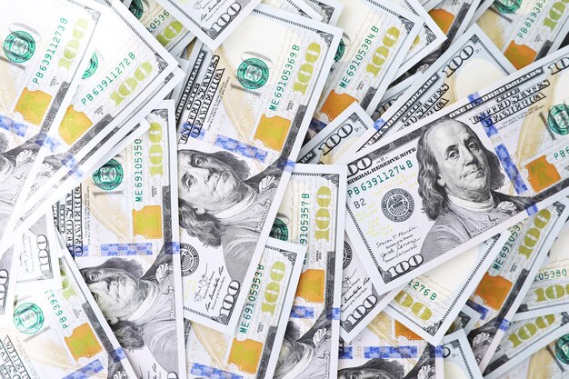 Gruppo di soldi pila di 100 dollari US banconote un sacco di texture di sfondo. Denaro contante in una grande pila come sfondo finanziario.