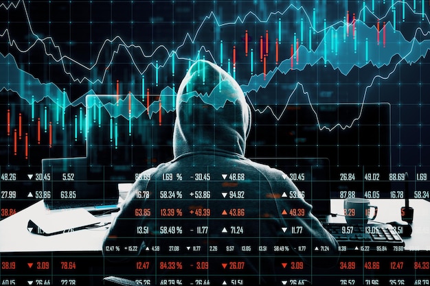Hacker using computer with chart