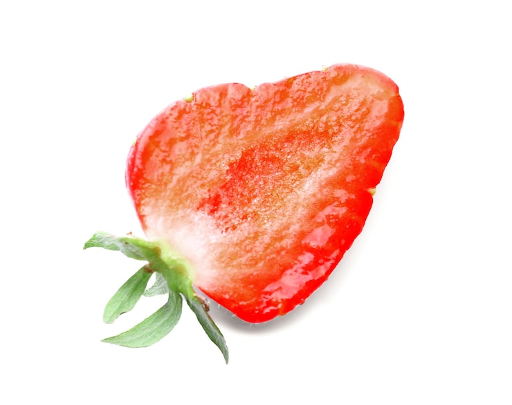 Photo half of tasty red strawberry on white background closeup