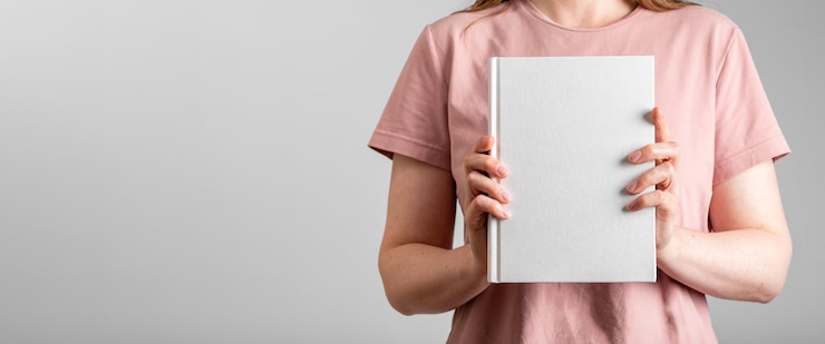 Photo hand holding paper book mockup hardcover mock up banner background with copy space for text