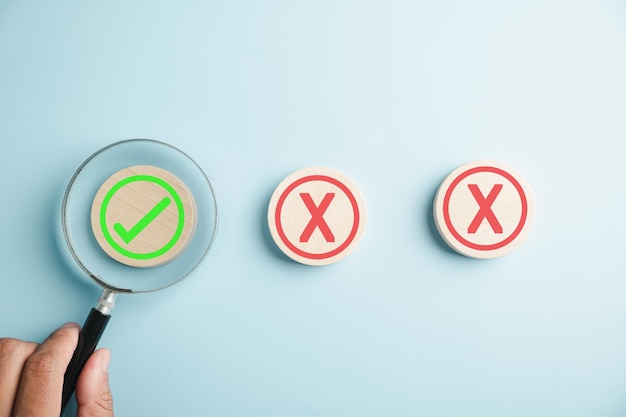 Hand with magnifying glass symbolizes business decisionmaking