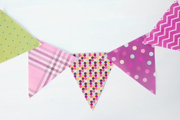 Handmade colorful garland on light background