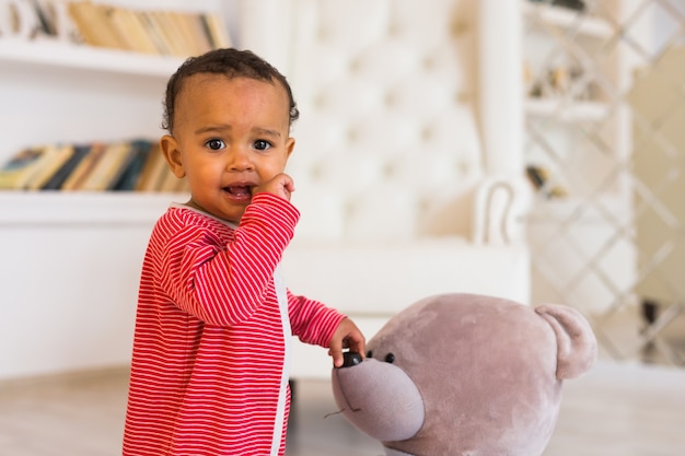 Happy Mixed Race Toddler Baby Boy al chiuso