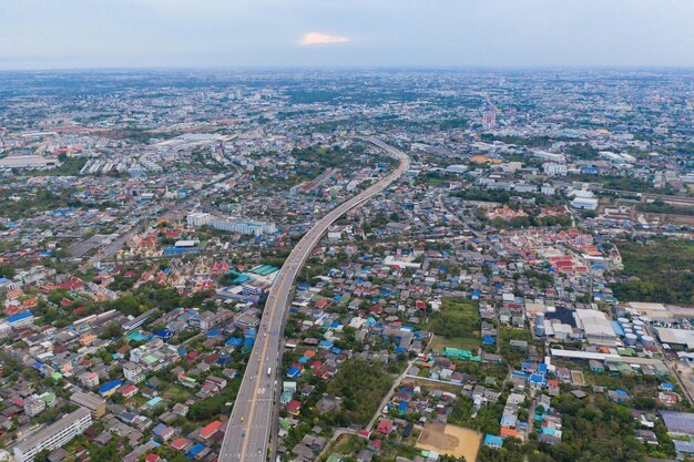 High angle view of crowd on road amidst buildings in city