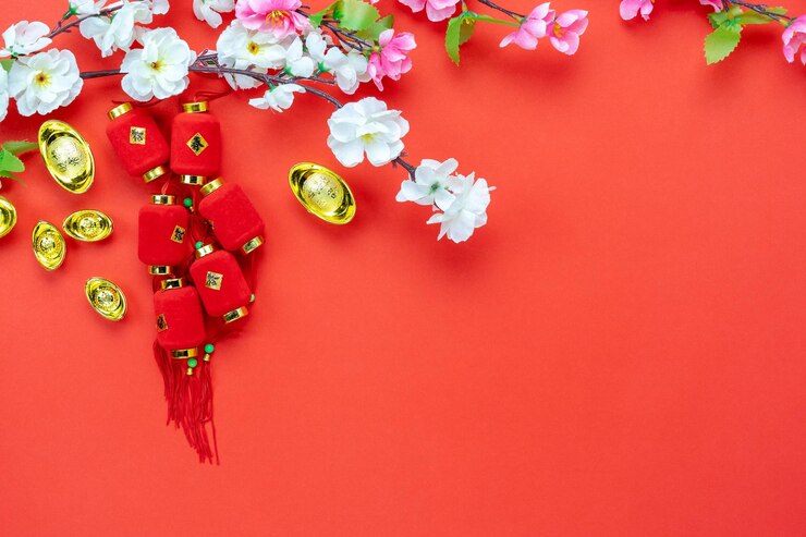 Photo high angle view of ingots and flower on red background