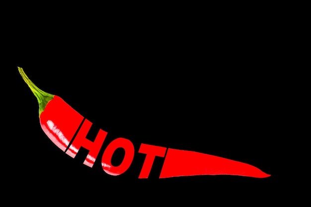 Hot creative HOT text written on red hot chili pepper Black insulated background