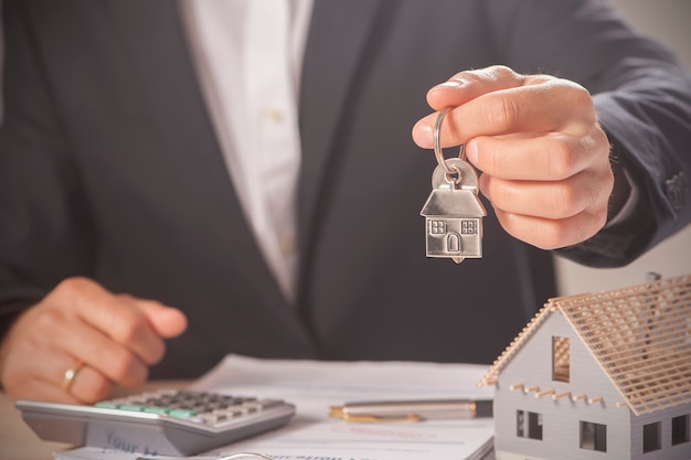 House keys and model house concept for selling or moving home