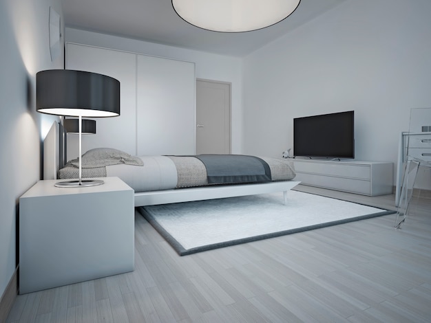 Idea di spaziosa camera da letto moderna con pareti grigie e grande letto morbido e comodino rigoroso con paralume nero.