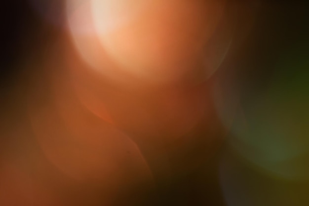 Il bokeh defocused astratto giallo accende il fondo