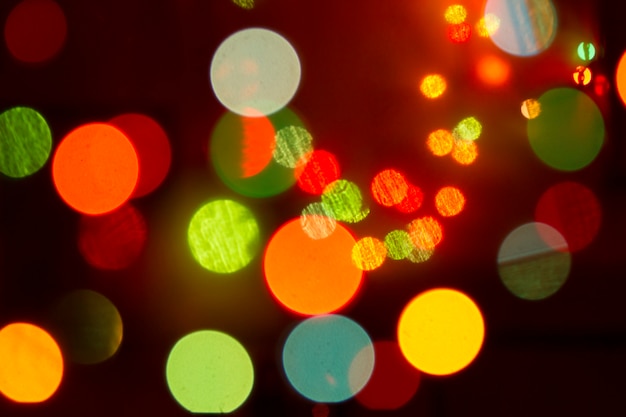 Il colore del bokeh di scintillio illumina la priorità bassa defocused