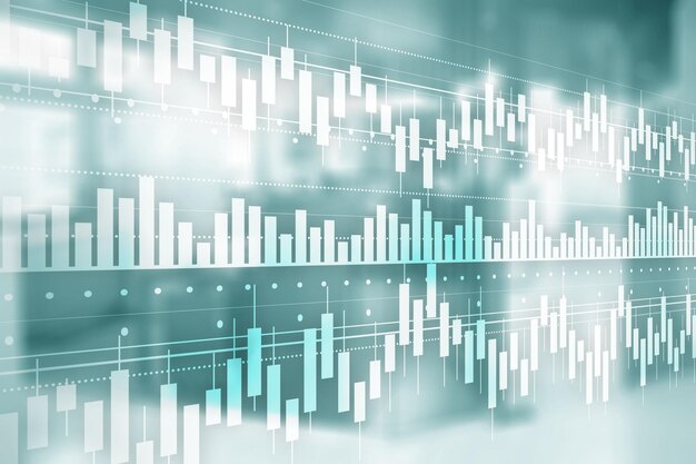 Il concetto di business con il grafico a candela stick del trading di investimenti nel mercato azionario e sfocatura dello sfondo dell'ufficio