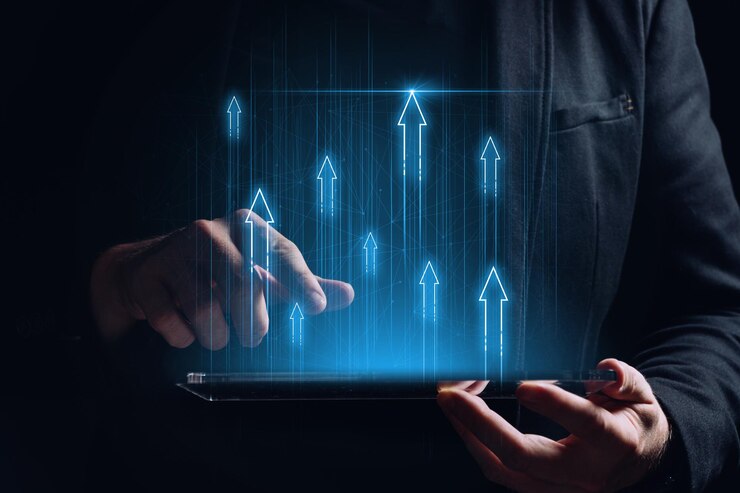 Foto il concetto di successo nella crescita economica e finanziaria del business con le frecce su un tablet nella persona delle mani