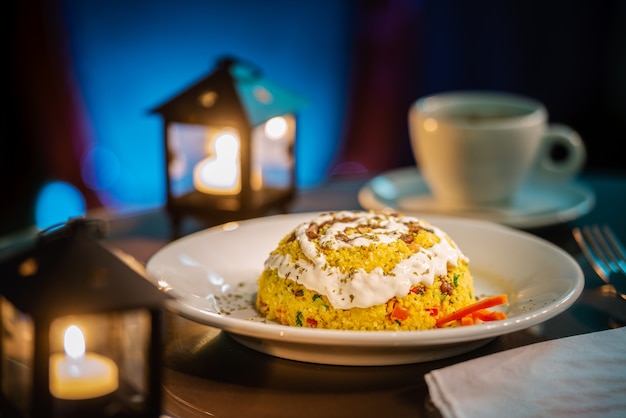 Il cous cous di mais è consumato soprattutto nel nordest del Brasile, solitamente accompagnato da una tazza di caffè.