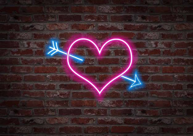 Il cuore trafitto da una freccia. Forma al neon leggero su un muro di mattoni