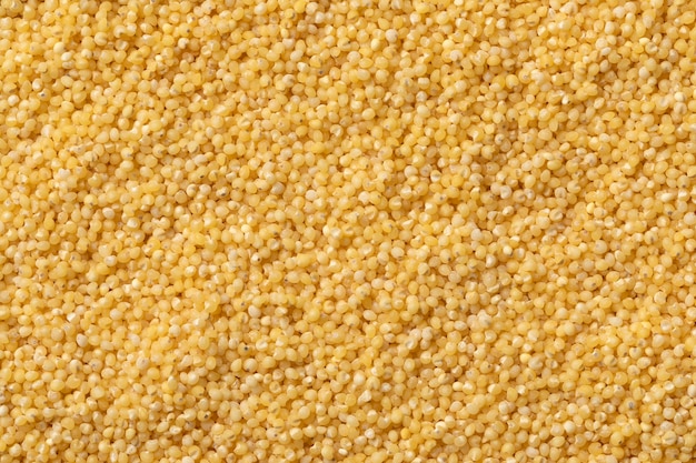 Il miglio giallo secco crudo chiude il fotogramma completo come sfondo