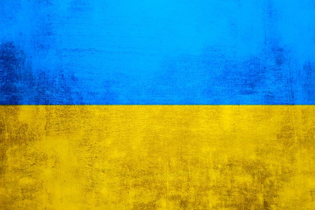 Il muro è nei colori della bandiera nazionale ucraina blu e giallo Sfondo astratto texture
