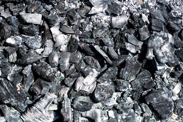 Il nero minerale del carbone come fondo di pietra del cubo. Modello di carbone