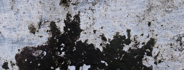 Il vecchio cemento pieno di macchie e graffi può essere usato come sfondo