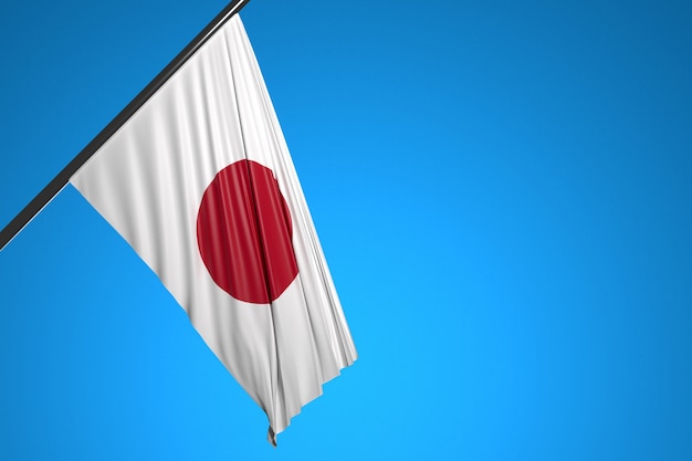 illustrazione della bandiera nazionale del Giappone su un pennone di metallo che fluttua contro il cielo blu