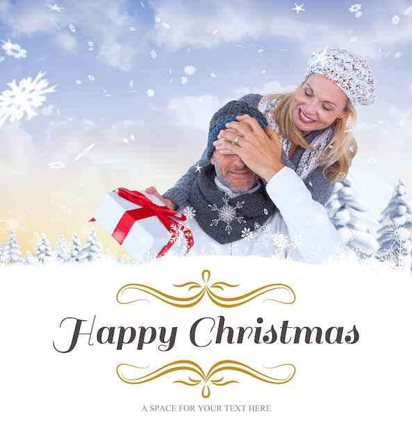 Immagine composita delle coppie felici di inverno con il regalo