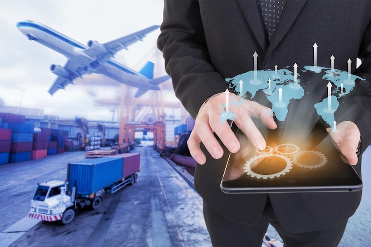 Foto immagine composita digitale di un uomo d'affari che utilizza un tablet digitale con icone al molo commerciale