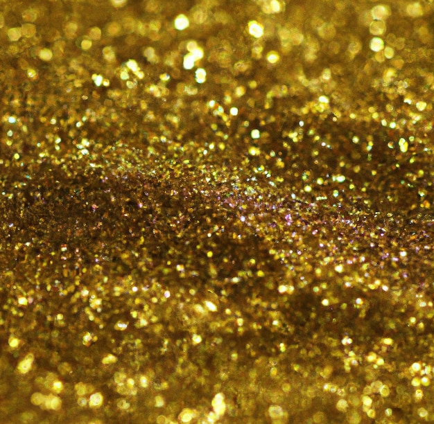 Immagine di primo piano di sfondo di particelle di glitter oro con spazio di copia