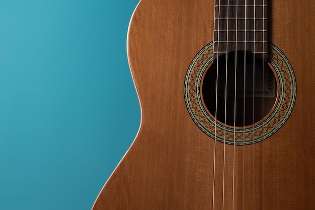 Immagine di una chitarra su sfondo blu da utilizzare come banner pubblicitario o sfondo del desktop