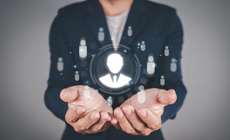 Imprenditore che mostra un'icona umana grafica virtuale per la leadership di assunzione dello sviluppo umano Gestione delle risorse umane