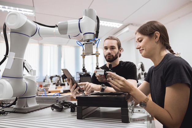 industrial robotics program university students learning education mechanical assembly with robot universal training platform robot arm simulation model in engineering lab classroom
