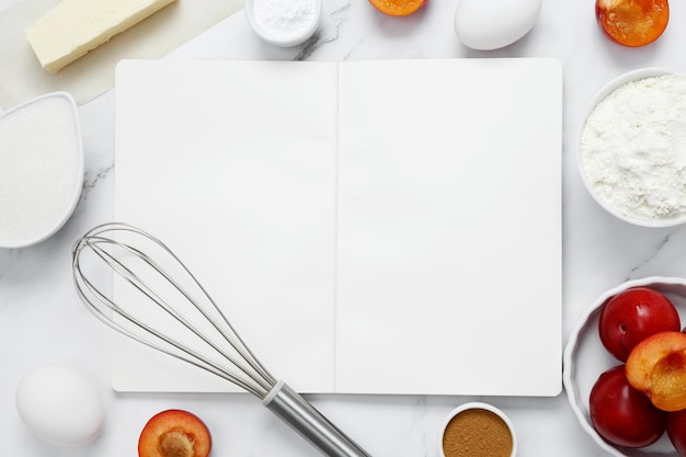 Ingredienti per la preparazione di torta classica Concetto di cibo fatto in casa dolci stagionali Mock up notebook