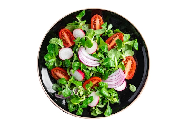 insalata fresca verdura cibo pomodoro, ravanello, lattuga mache, foglie verdi spuntino sulla copia del tavolo