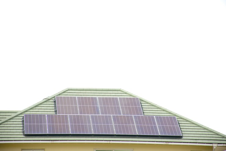 Photo installing a solar cell on a roof solar panels on roof modern house with modern solar panels on tile roof and wall against clear sky background 2025