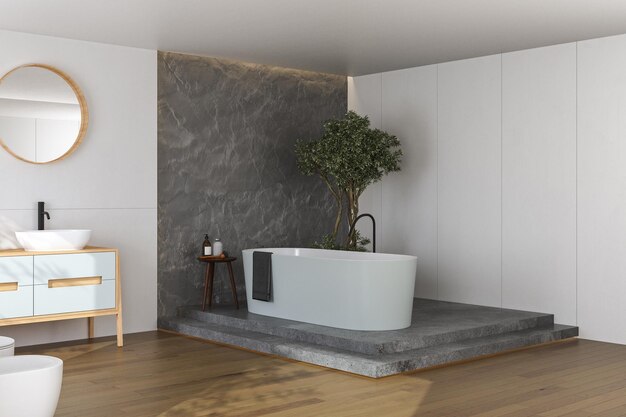 Interni eleganti del bagno con pareti bianche e in cemento, lavabo bianco con specchio ovale, vasca da bagno