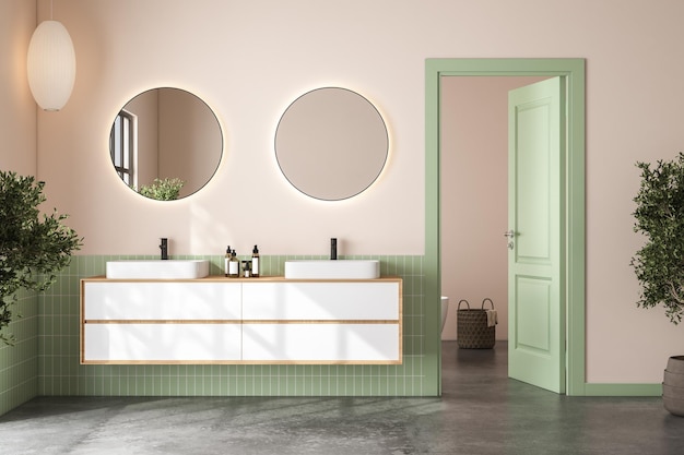 Interno del bagno moderno con piastrelle verdi e pareti beige pavimento in cemento doppio lavabo bianco su piano di lavoro in marmo con specchi ovali sopra di esso e comoda vasca bianca rendering 3d